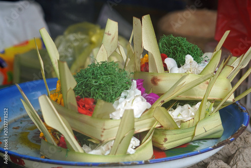 Traditional floral offerings in palm baskets