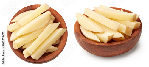 sliced raw potato in wooden bowl isolated on white background. clipping path