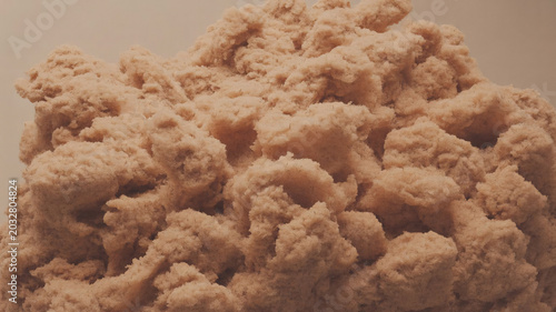 Brown dough, raw pastry, lump of clay, beige texture, close-up