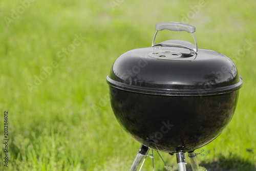 Metal brazier with lid on g...