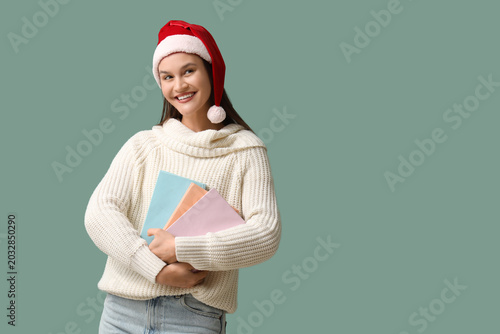 Happy young woman in Santa ...