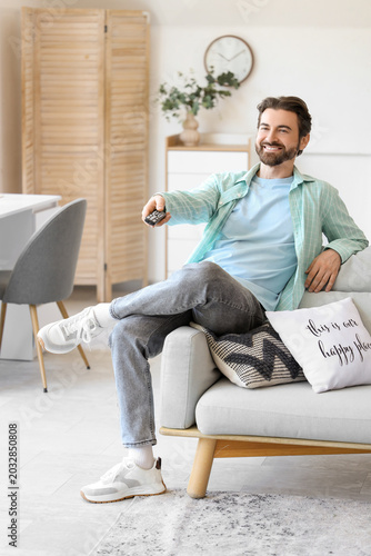 Young man with remote contr...