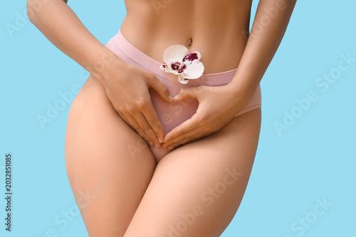 Young woman in panties with...
