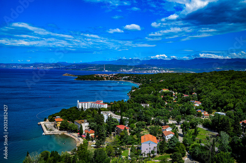 Fotografija Aerial view of the scenic coastline of Omišalj on Krk Island featuring hotels, greenery and crystal-clear Adriatic waters