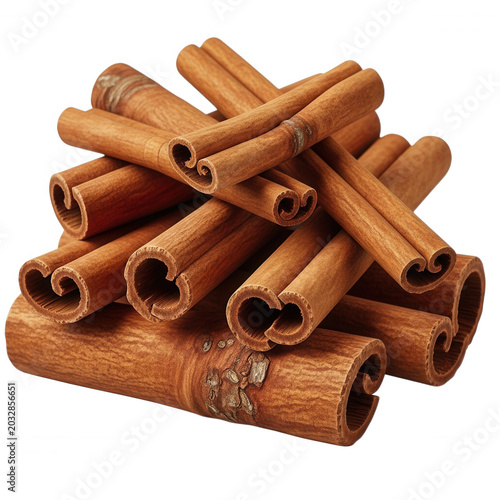 A stacked pile of dried cinnamon sticks with curled bark textures, isolated on a solid black background, for food