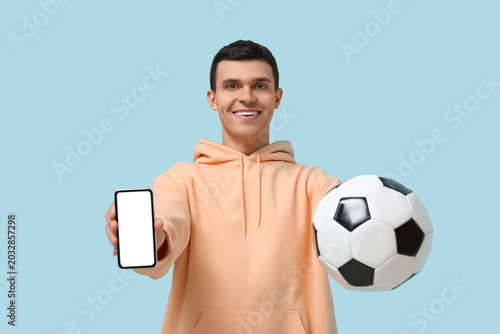 Young man with soccer ball ...