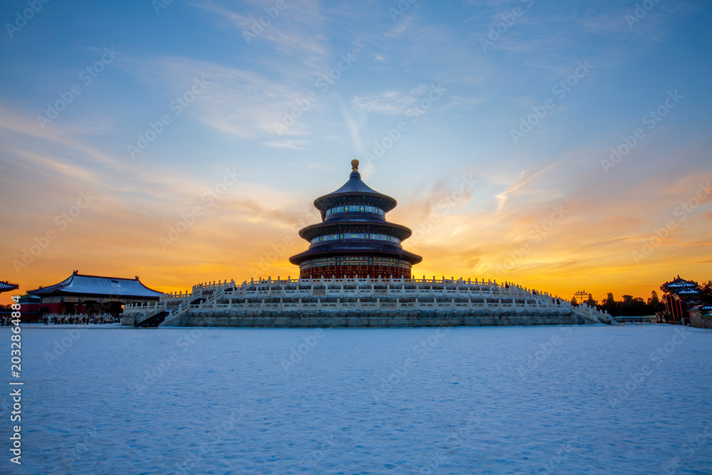 Fototapeta premium The Hall of Prayer for Good Harvests at the Temple of Heaven with sunset glow after snow, Beijing, China