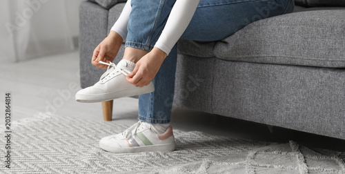 Woman in stylish sneakers a...