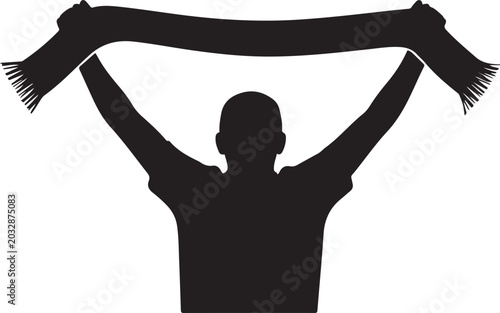 Φωτογραφία A black silhouette of a person, likely a sports fan, seen from behind, holding a scarf aloft with both hands