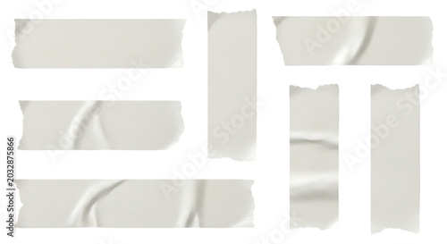 Collection of white adhesive masking tape strips with torn edges and wrinkled texture on black background for mockup design elements