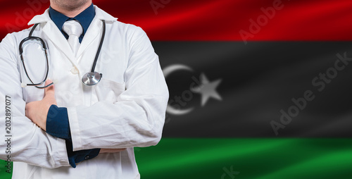 Canvas-taulu Male doctor with stethoscope on Libyan flag
