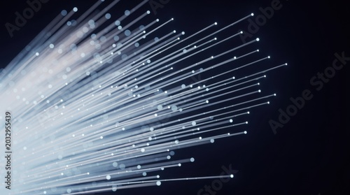 A bundle of glowing fiber optic strands transmitting light against a dark background, symbolizing high-speed communication and data transfer.