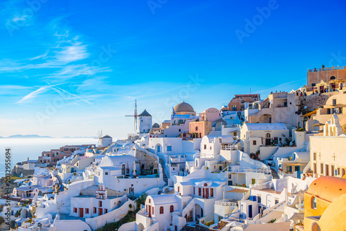 Obraz na płótnie Oia windmill and white houses above the caldera
