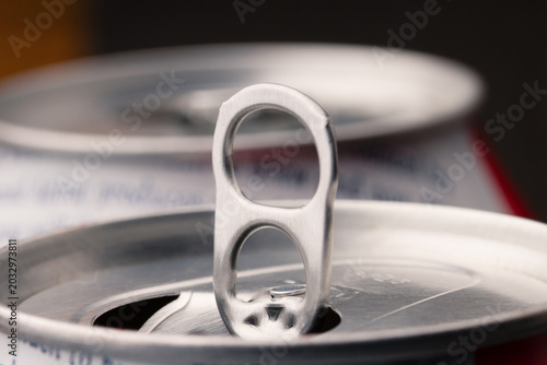 Close-up of aluminum soda can tab, macro of open metal beverage can with copy space