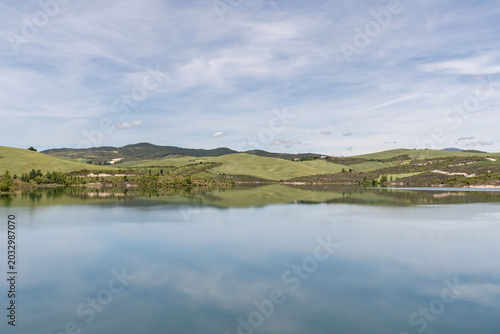 Reflections in the reservoir between fields of crops. Villaveta, Navarra