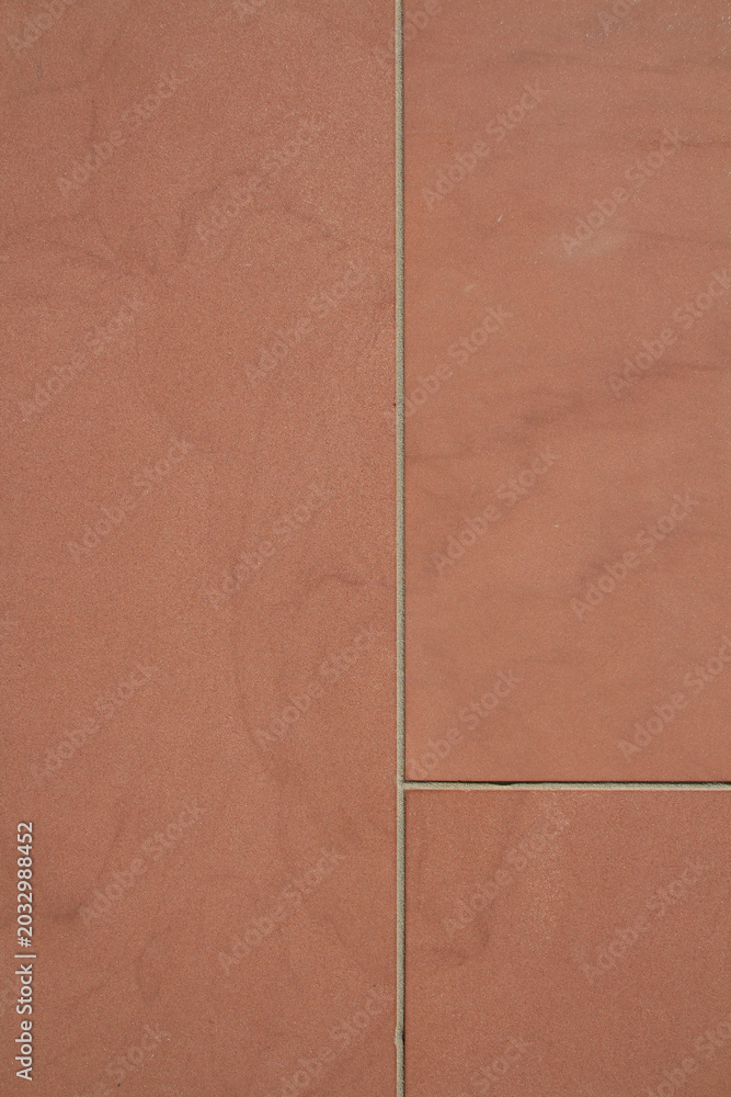 Fototapeta premium Red Stone Wall with Minimalist Architectural Lines