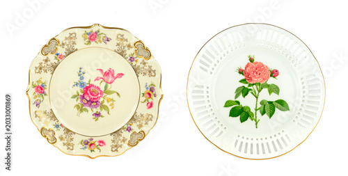 Photos Two exquisite porcelain side plates isolated on a clean white background
