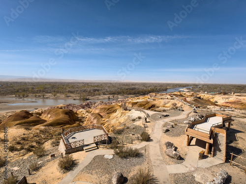 Stunning landscape of Wucaitan (Five Colored Hills) and the Irtysh River in Burqin, Xinjiang, China.