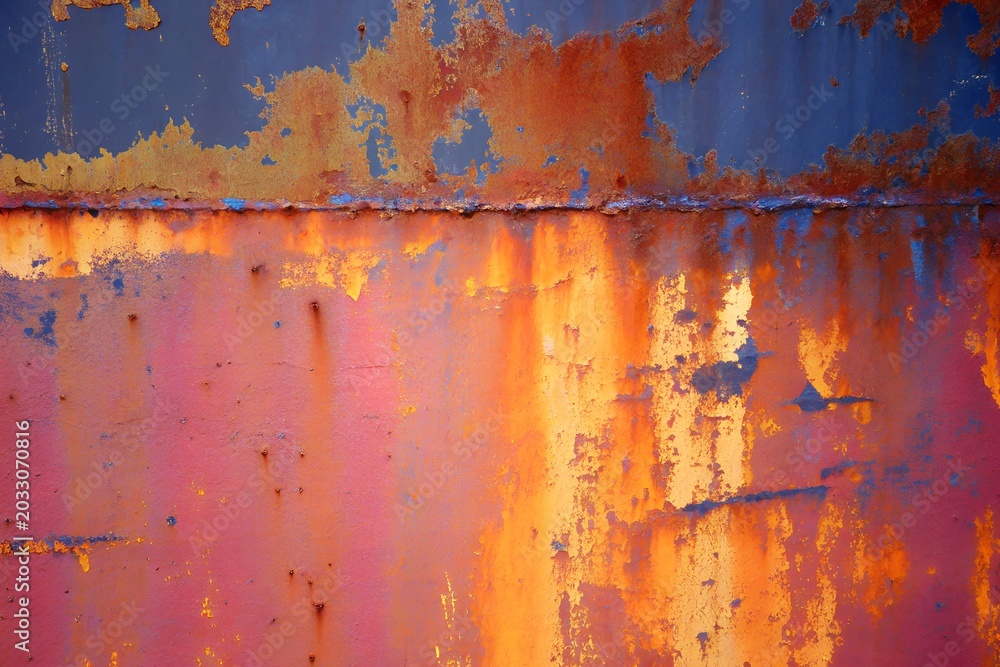 Fototapeta premium Abstract Rusty Metal Surface with Peeling Blue and Orange Paint Background 