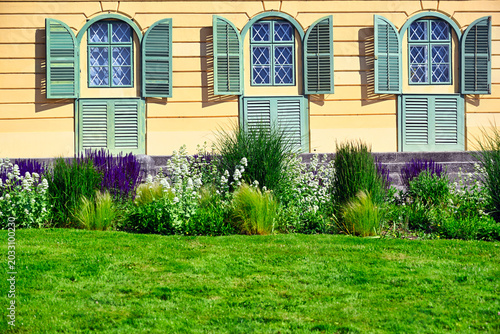 Esterhazy Palace Facade with Green Window Shutters and Flower Garden in Eisenstadt Austria