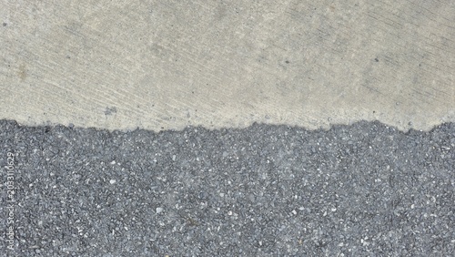 Foto Asphalt and concrete road surface texture contrast