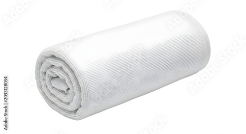 A rolled up white blanket on a plain surface