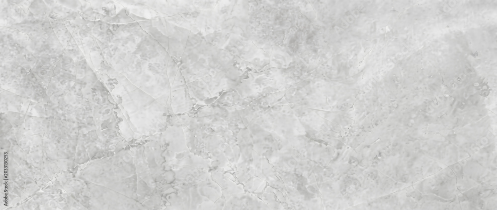 Naklejka premium Marble background shows a beautiful white polished stone surface with natural organic fracture lines