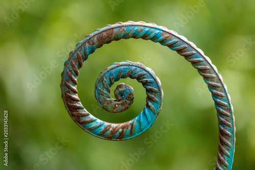 Schilderij op canvas Curved metal pipe with verdigris coating