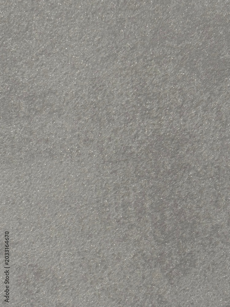 Fototapeta premium Gray concrete surface texture with rough granular finish close up