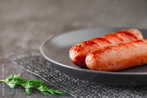 grilled sausages on plate, selective focus