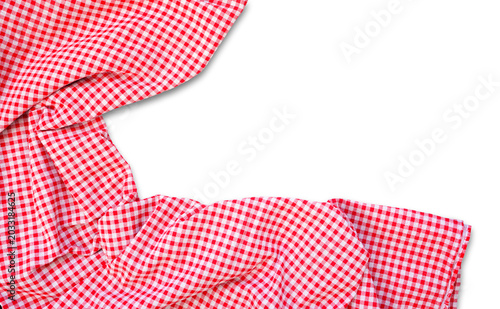 Picnic theme red and white check table cloth. Above view corner border isolated on a white background.