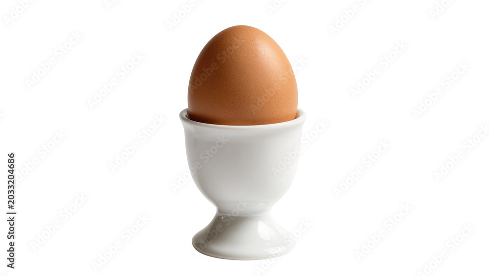 Photography Brown egg in white ceramic egg cup