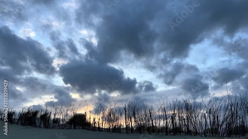 Cloudy evening sky at dusk over Norderney sand dunes