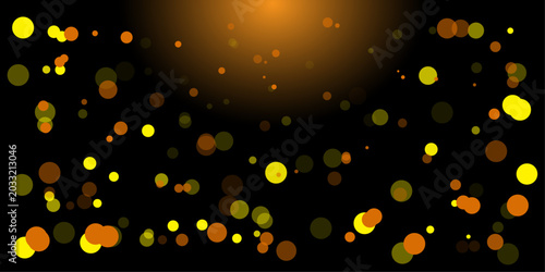 Fotografie Vibrant light effect with glowing orange and yellow bokeh on black background