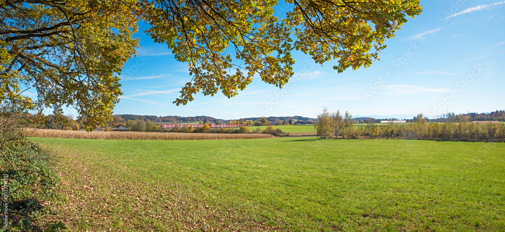 Obraz premium View from the edge of the forest south of Ebersberg. train to Grafing; autumn landscape.