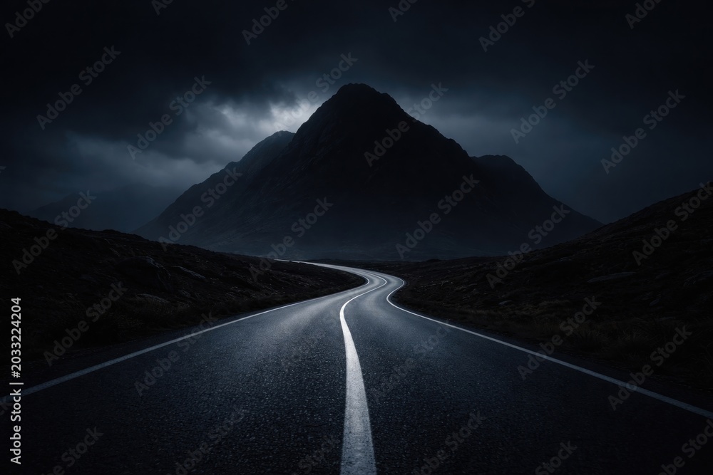 Fototapeta premium Mysterious road under dark mountain.