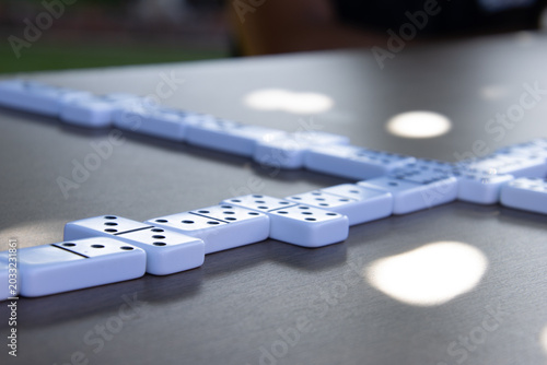 Domino tiles arranged on table in soft natural light
