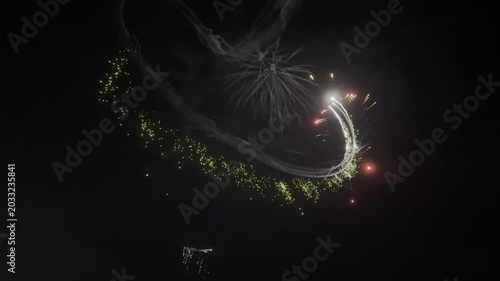 A Drone View of July 4th Fireworks, Captured at Half Speed, With Multiple Bursts in all Colors on a Calm Summer Night 