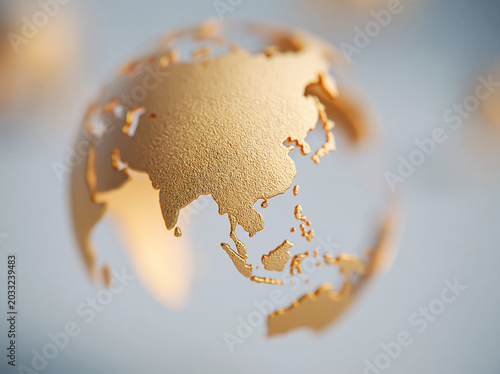A minimalist globe with metallic rose gold continents floats against a soft grey background, focusing on Asia and Australia.
