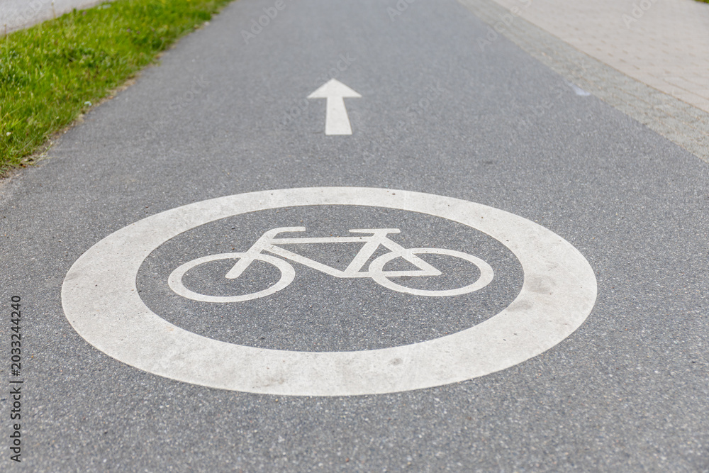 Fototapeta premium Bicycle path sign on the asphalt road
