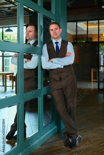 a man in a business suit in a stylish interior