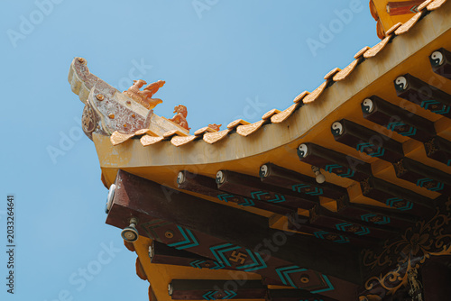 Принти на полотні Ornate Chinese temple roof details with yellow tiles