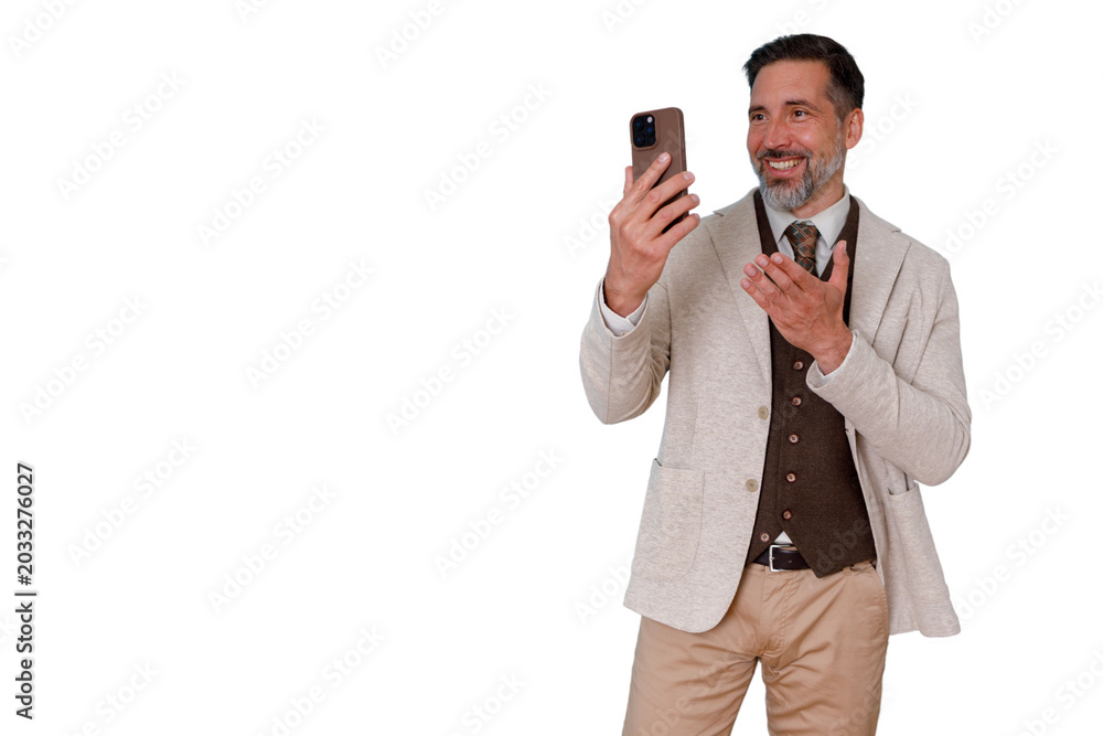 Naklejka premium Mature man in business casual wear using smartphone for a video conference, discussing and smiling, engaging virtually