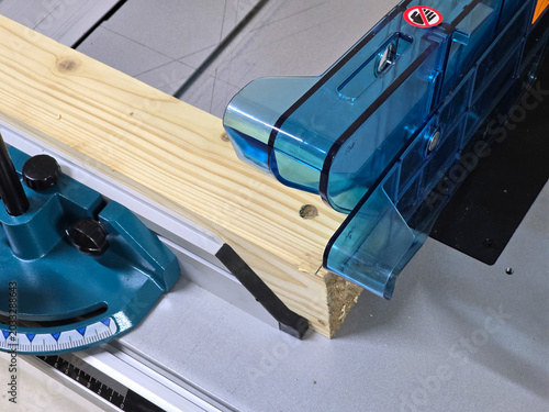 Photos A circular saw cuts a wooden board