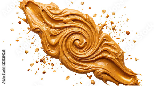 Swirl of creamy peanut butter with scattered roasted peanuts isolated on transparent background