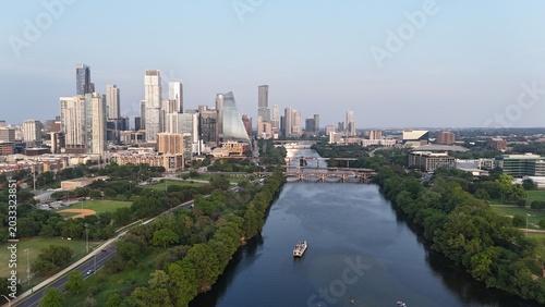 Downtown Austin looking east while hovering over the Colorado River, also known as Lake Austin at this point. And also known as Town Lake or ladybird Lake in the central part of the city. 