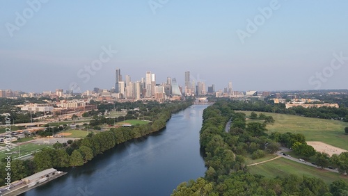 Downtown Austin looking east while hovering over the Colorado River, also known as Lake Austin at this point. And also known as Town Lake or ladybird Lake in the central part of the city. 