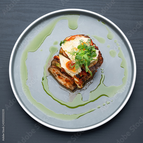 Fotografie Top view of roasted vegetable stack with parmesan cheese shavings