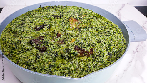 Fotografía Traditional Cameroonian Ndole soup made with bitter leaves and peanuts in white