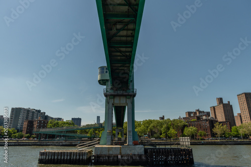 Underside of the Wards Island bridge in summer viewed from a boat, Manhattan, New York City